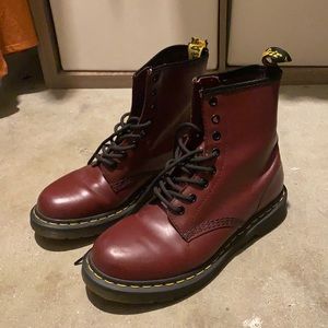 Size 8 maroon Dr. Martens, good condition, ripped tag on back of right shoe.